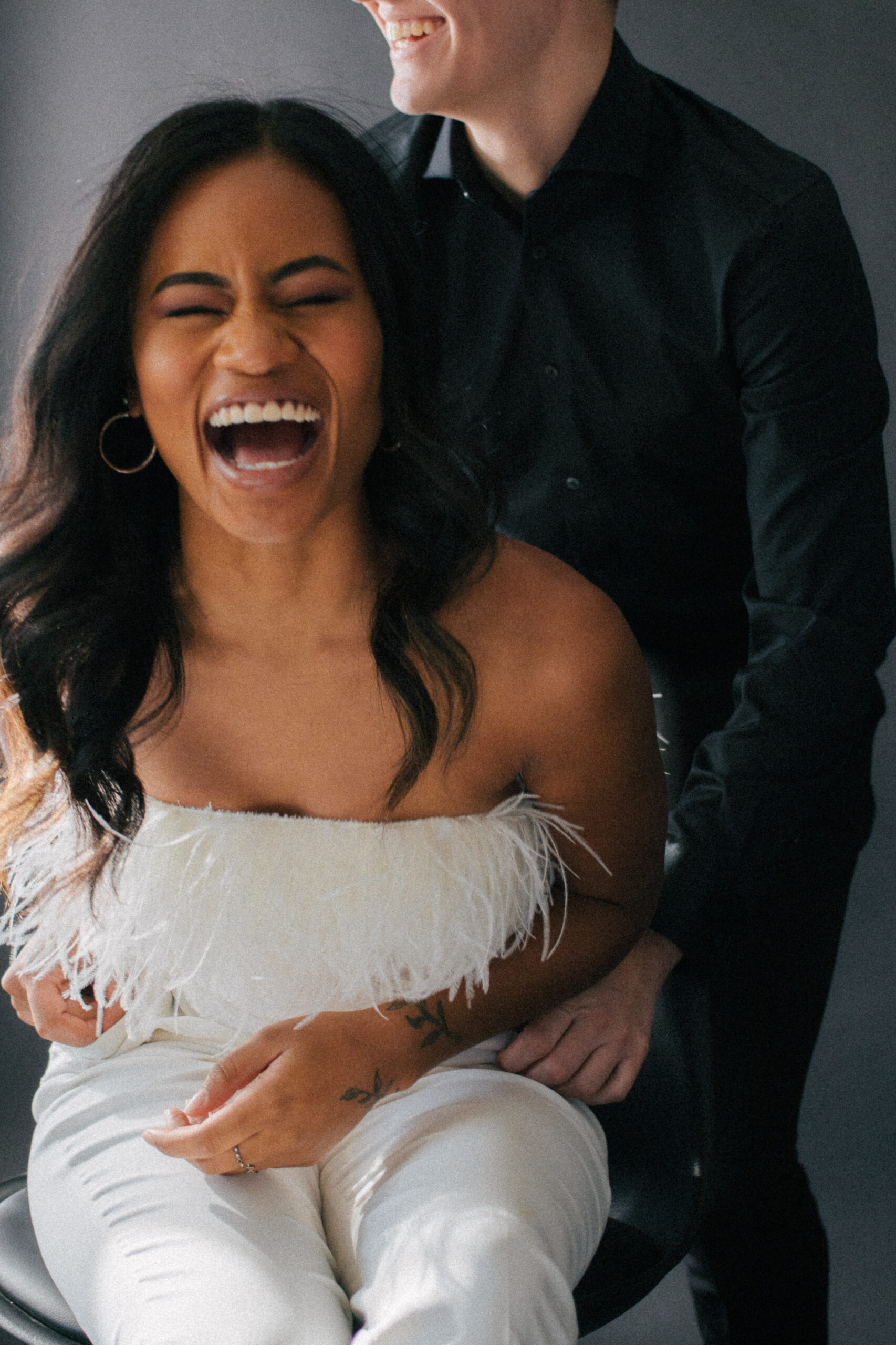 Couple spontaneous laughing at edgy elopement