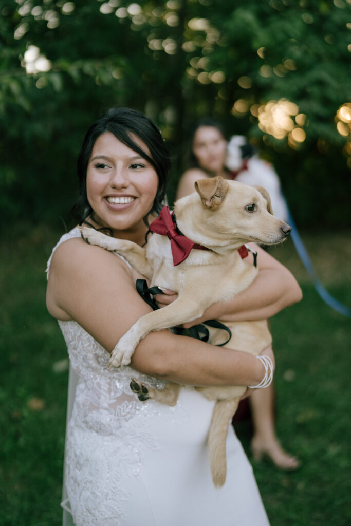 Bride at Venue at Stockton Lake holding dog