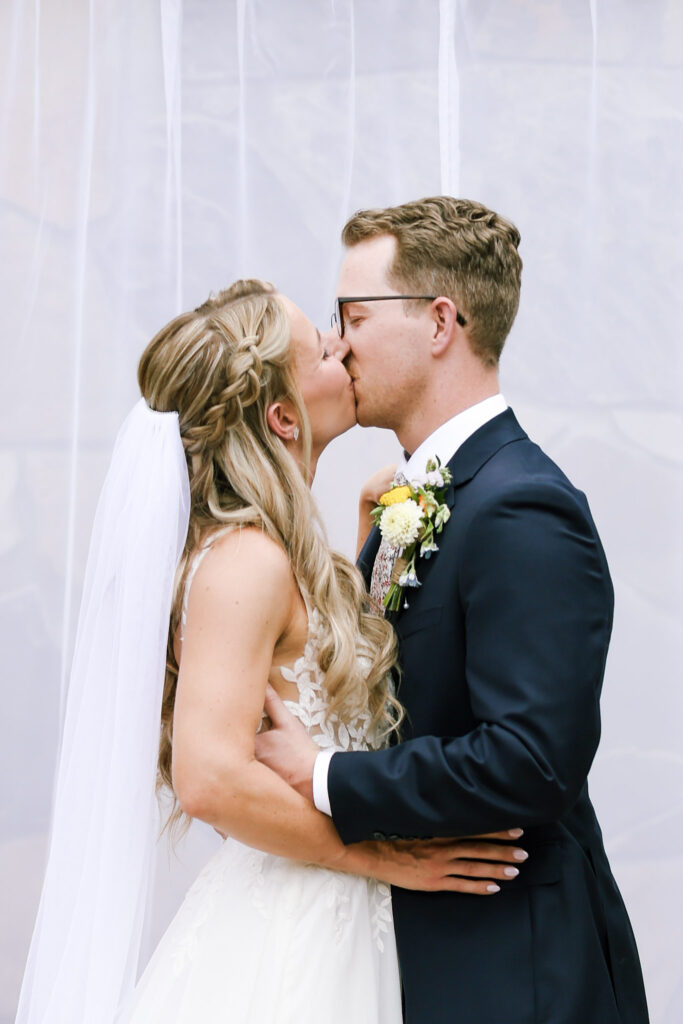 Chelsea Stanford Photographer Springfield MO First kiss at Juniper Gardens, Hillside location Fair Grove, MO